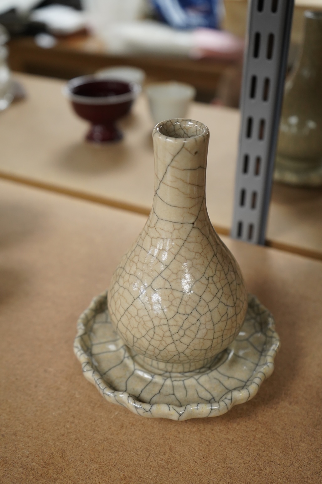 A Chinese crackle glaze bottl vase and similar stand, vase 15cm